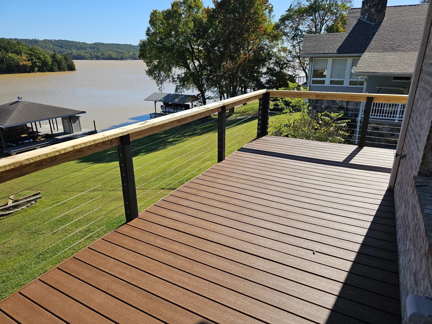 Custom lakeside deck with cable-style railing